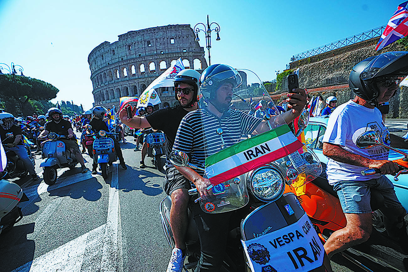 Vespa scooters swarm Rome’s historic center